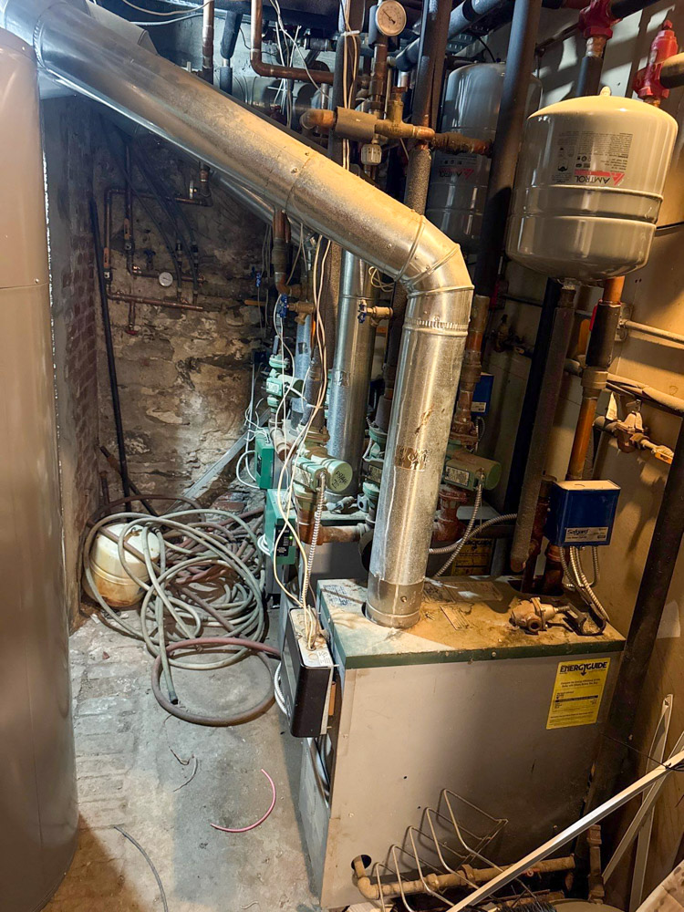 Old boiler system in a Beacon, NY basement before repair and maintenance by Shelter Air, the octopus HVAC company.
